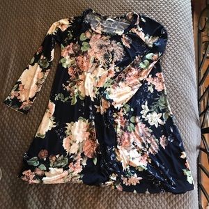 Floral print dress comes above the knee.